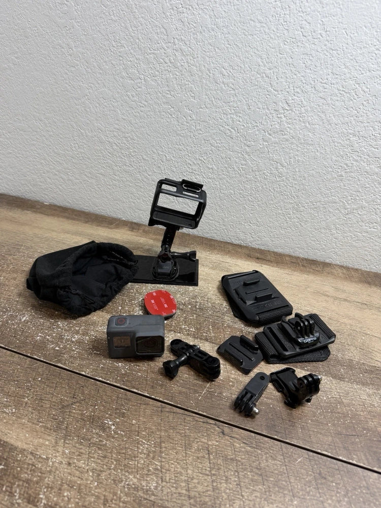 GoPro HERO5 Session action camera kit with mount, cases, and several attachments