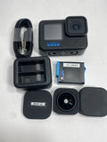 GoPro HERO10 Black action camera bundle with accessories: battery, SD card, cable case