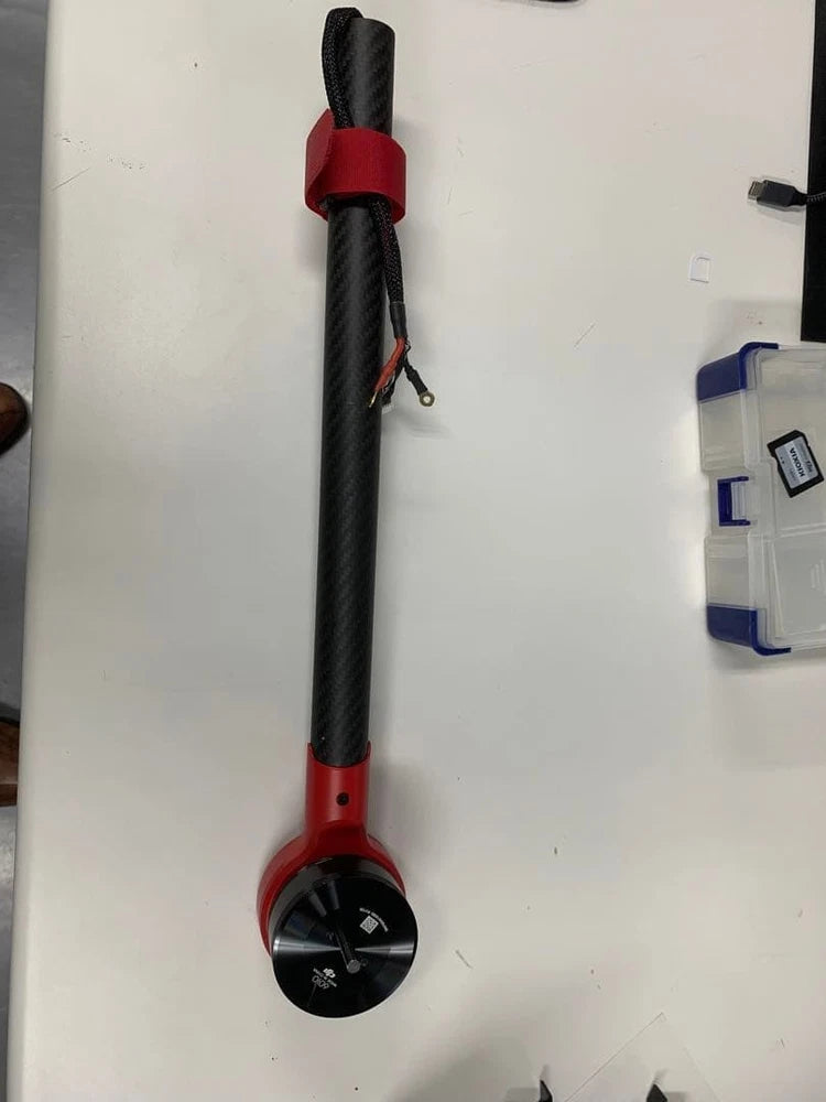 Drone motor arm replacement part with black motor housing and red mount