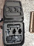 Foldable RC drone in padded travel case, black foam insert with drone components