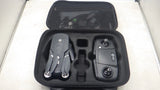 Black carrying case with controller and drone accessories, including landing gear and prop parts