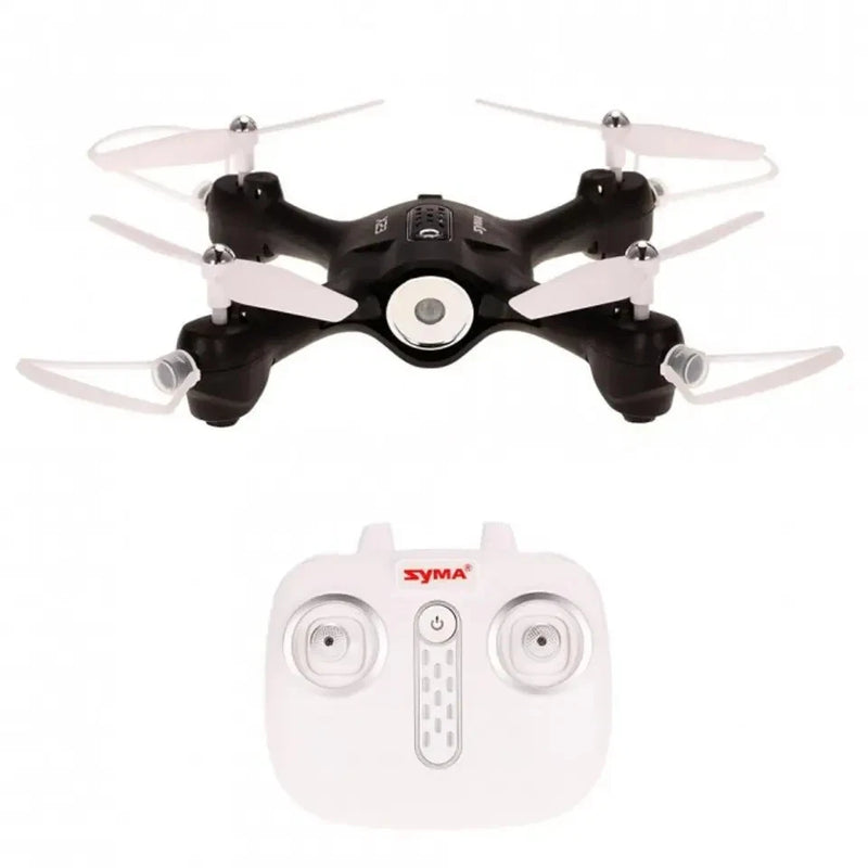 Black quadcopter drone with four propellers and white remote controller with joysticks