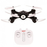 Black quadcopter drone with four propellers and white remote controller with joysticks