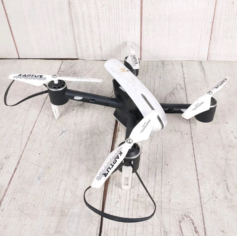 Black-and-white quadcopter drone with camera, four propellers, for parts only