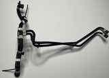 Black coolant hose line with tube fittings and clamps
