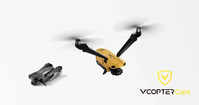 Yellow mini quadcopter drone with black arms and propellers