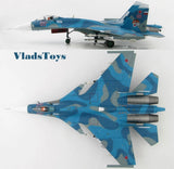 Blue camo fighter jet model with red markings, two-view display