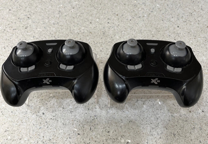 Set of 2 black X20 micro drone remote controllers with dual thumbsticks