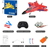 Red RC fighter glider toy with 2.4GHz remote control, spare blades, and battery kit