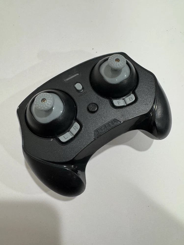Black handheld RC remote control with two thumb joysticks and multiple buttons