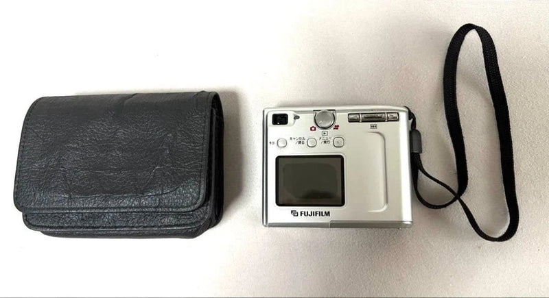 Fujifilm FinePix 4500 compact digital camera with black case and wrist strap