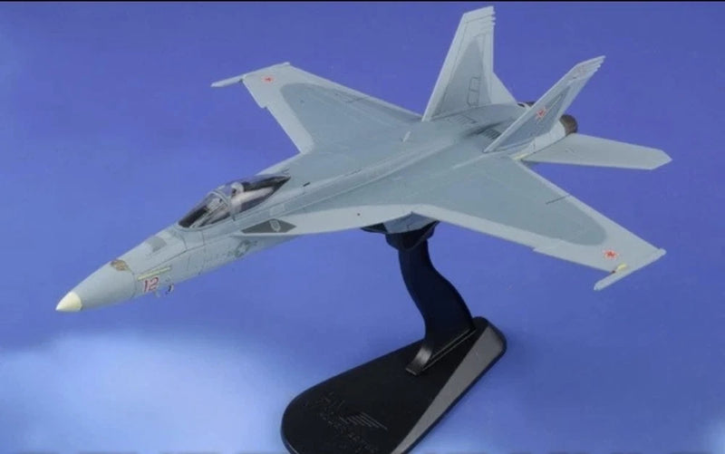 1:72 scale light gray F/A-18E Super Hornet model on black display stand