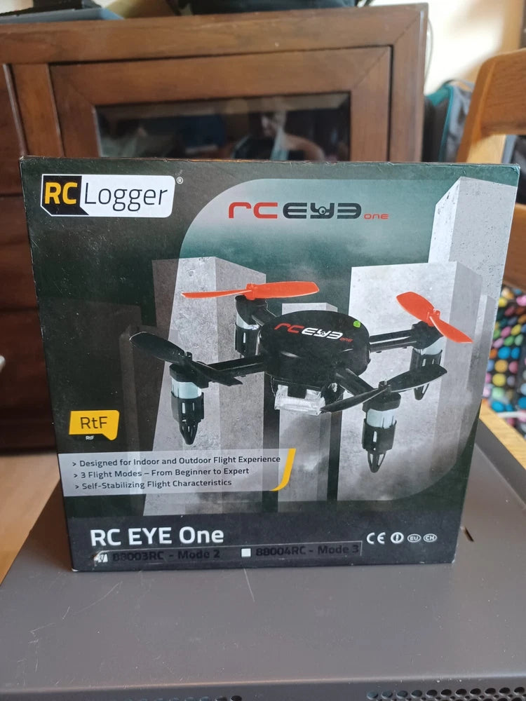 RC quadcopter drone box with printed drone illustration and orange propellers