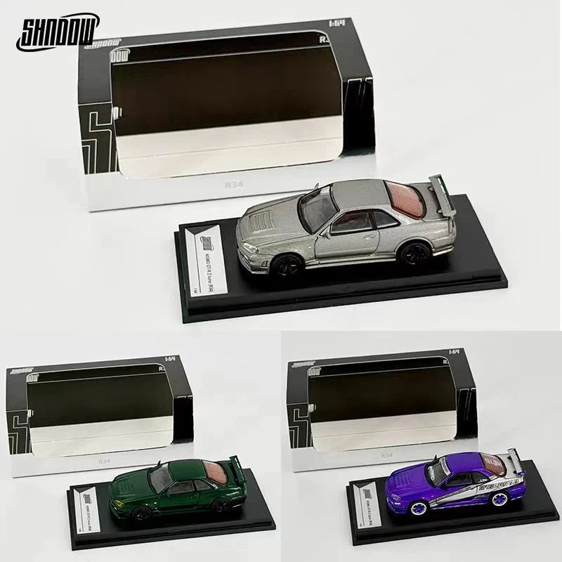 Silver alloy die-cast car model on black display base, collectible ornament