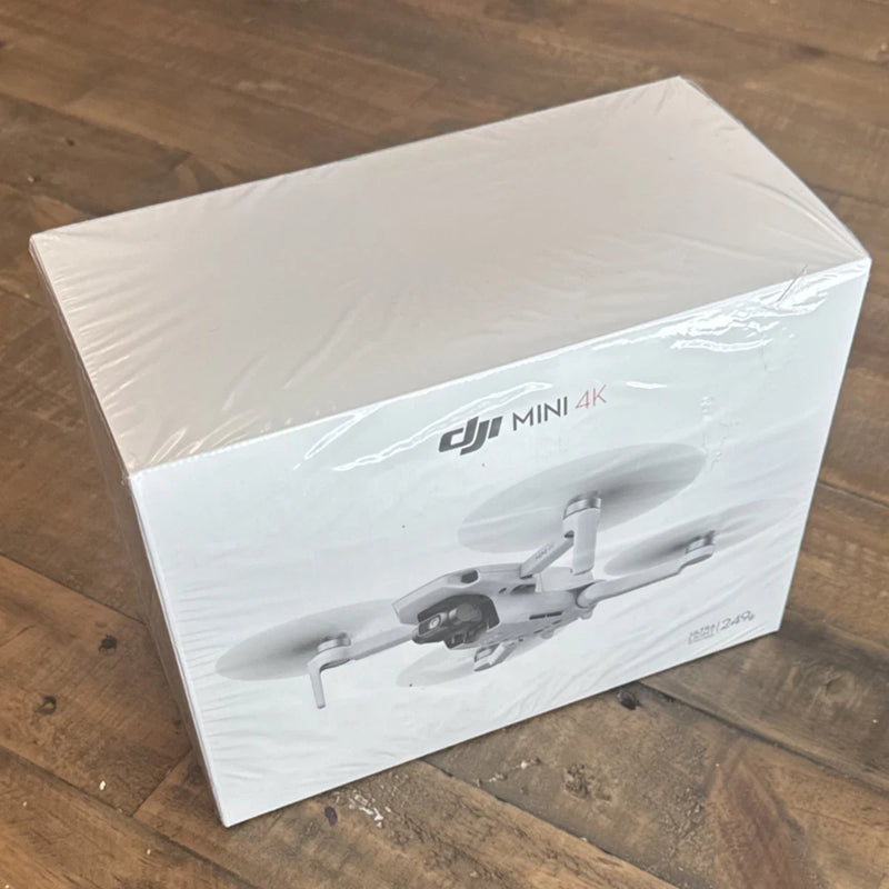 DJI Mini 4K drone box with printed drone illustration on white packaging