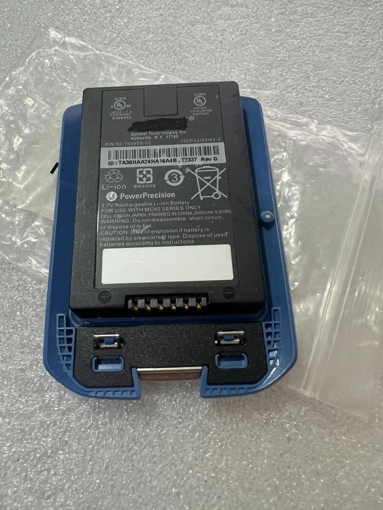 Li-ion scanner battery pack with label and charging contacts, in blue dock cradle
