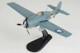 Blue-gray F4F-4 Wildcat model airplane with USN VF-9 markings on black stand