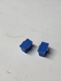 Two blue model car batteries with small mounting posts