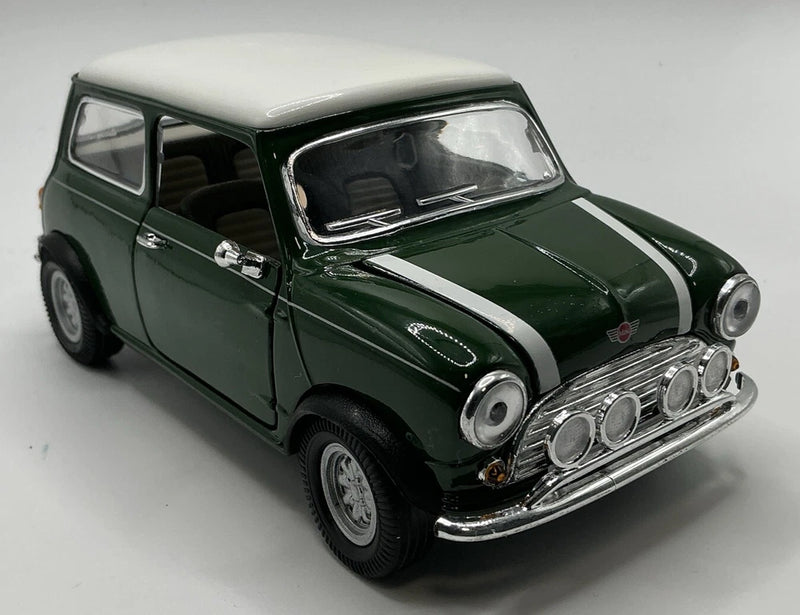 Green Mini Cooper die-cast model car with white racing stripes and chrome grille