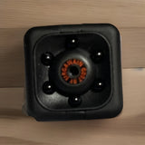 Portable mini video recorder camera, square black front with wide lens