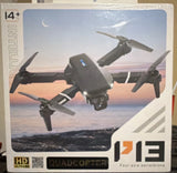Black quadcopter drone with four propellers and HD camera, shown on product box