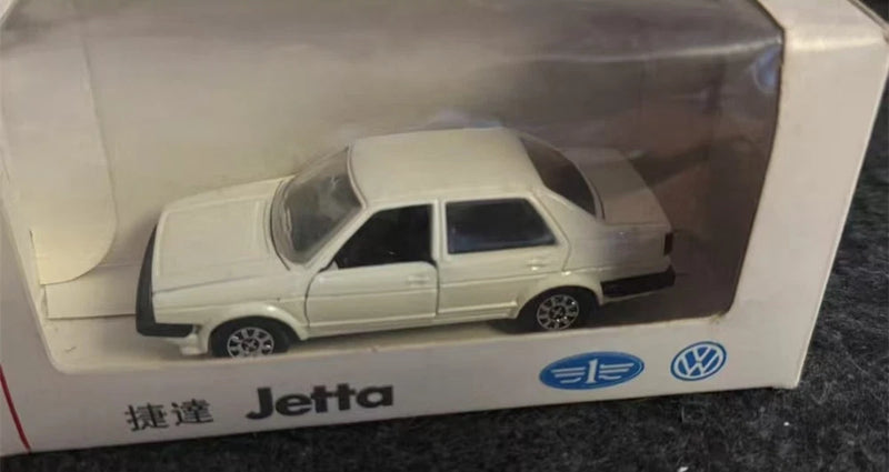 White 1:43 scale Volkswagen Jetta car model in display box