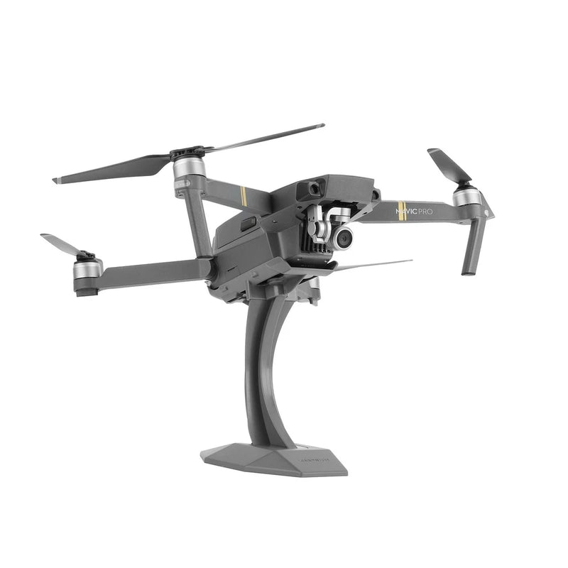 Desktop drone display stand with gray bracket holding a quadcopter