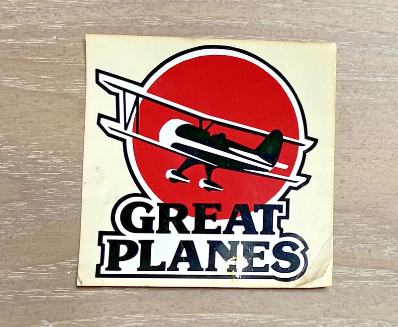 Vintage airplane decal sticker with red circle, black plane graphic, and GREAT PLANES text