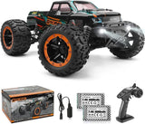 Black monster truck RC car with orange wheels, front headlights, detailed decals.