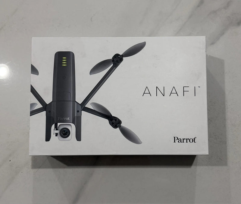Compact black quadcopter drone with front camera and four foldable rotors