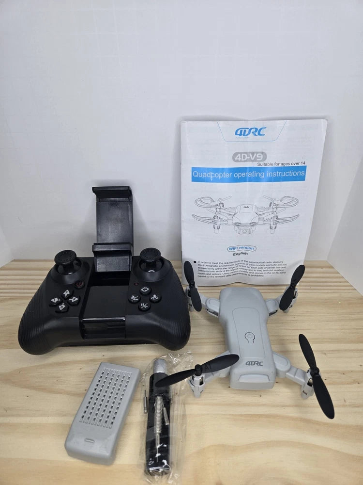 Beginner drone quadcopter kit with white drone, black controller, and accessory module