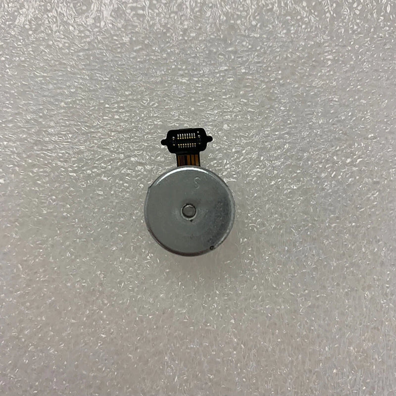 Drone motor repair part with gray circular housing and ribbon connector