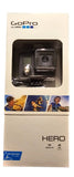 GoPro HERO action camcorder in clear sealed box with mount and camera lens visible