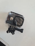 Digital action camera in clear protective cover with front lens and mounting bracket