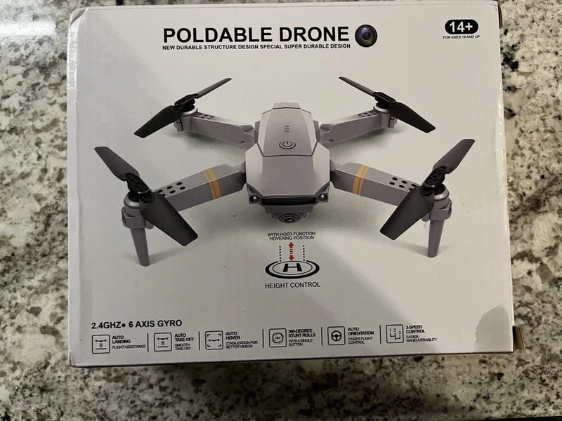 Foldable quadcopter drone product box with top view drone illustration