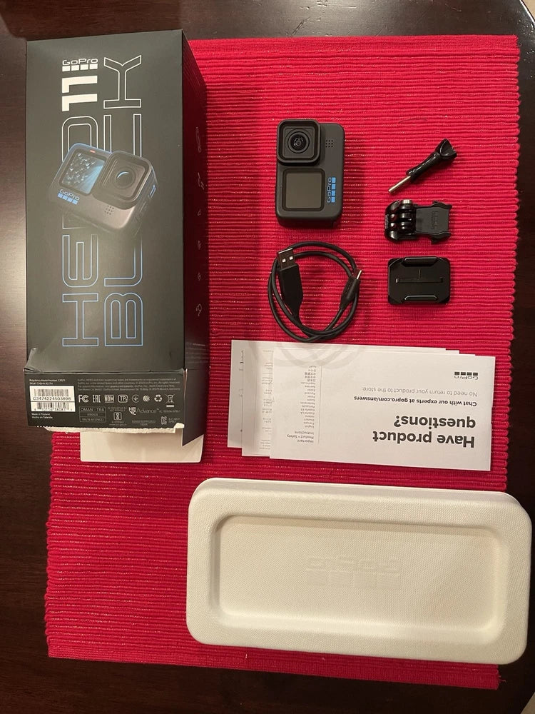 GoPro Hero 11 Black action camera kit with mounts, cable, and protective case