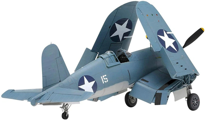 Light blue F4U-1 Corsair model airplane with black and white star markings, propeller