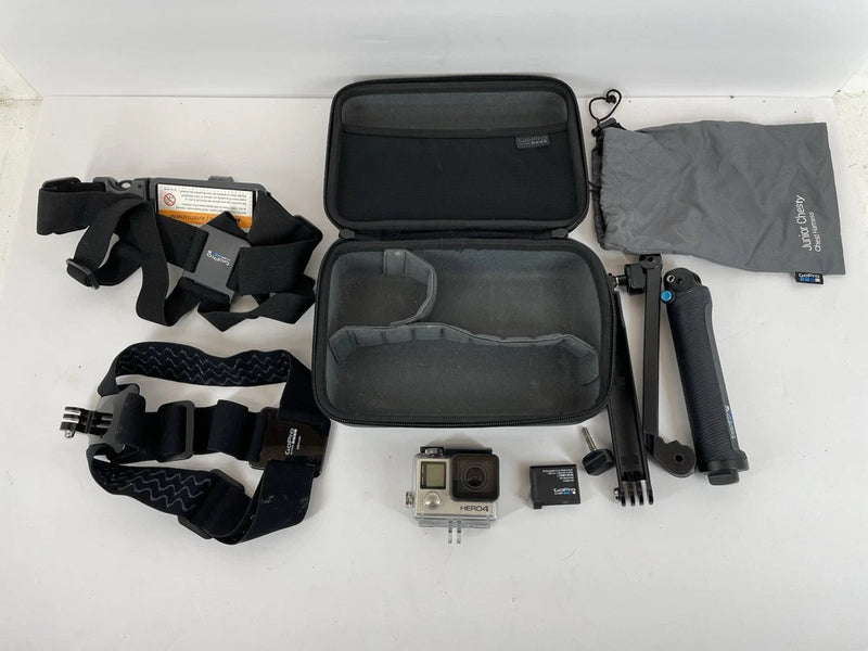 GoPro Hero 4 Silver action camera bundle with open case, mounts, and straps