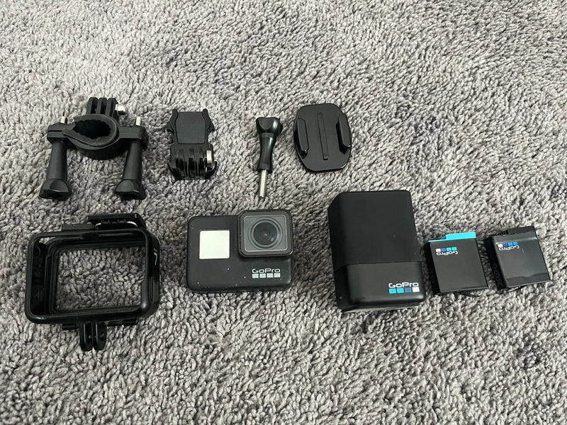 GoPro HERO7 action camera kit with black camera, mounts, case and extra batteries