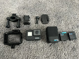 GoPro HERO7 action camera kit with black camera, mounts, case and extra batteries