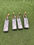 Set of four Phantom LiPo battery packs with labels and red/black wiring