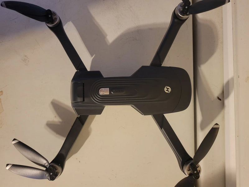 Holy Stone HS175D GPS drone with four black propellers and foldable arms