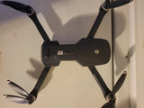 Holy Stone HS175D GPS drone with four black propellers and foldable arms