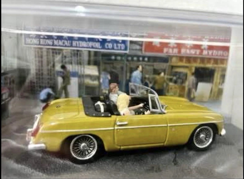 MGB James Bond yellow die-cast convertible car model, 1:43 scale, detailed chrome wheels