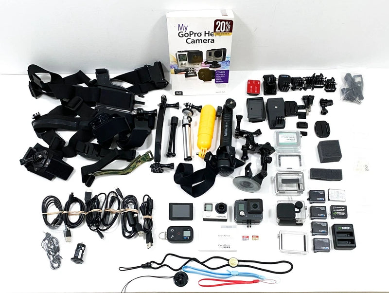 GoPro HERO4 action camera accessory bundle with batteries, charger, mounts, remote, manual