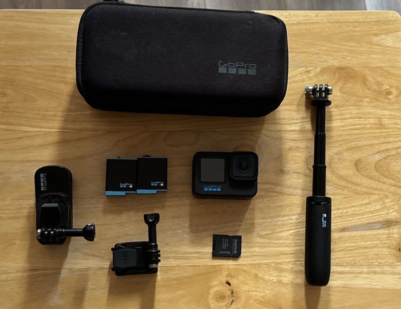 GoPro HERO10 Black action camera bundle with case, grip stick mount, and extra mounts