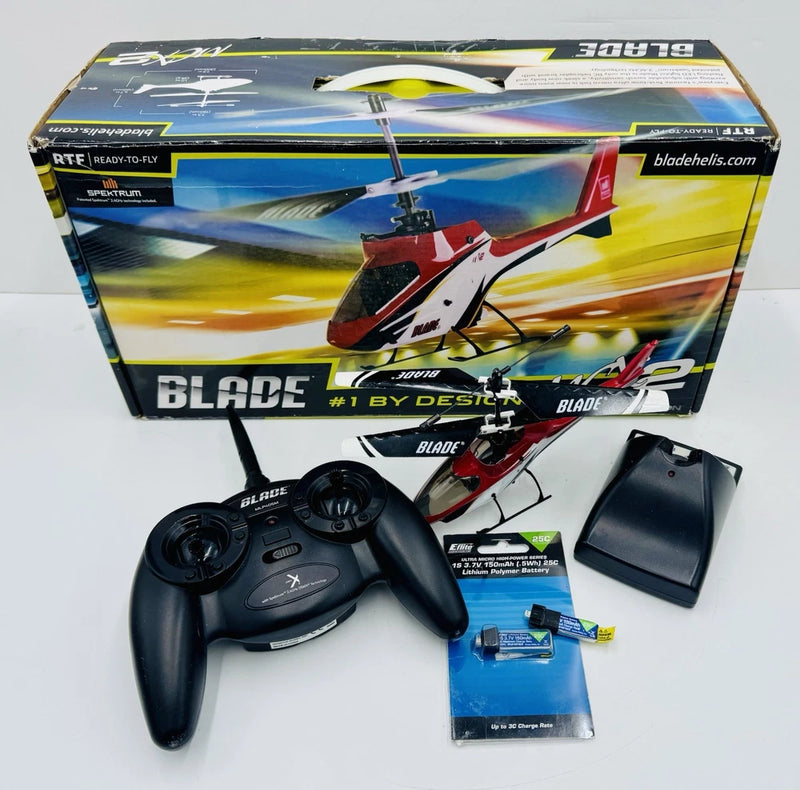 Blade RC electric helicopter kit with transmitter controller, charger, and batteries