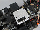 Silver perforated aluminum servo stay plate with mounting holes for RC chassis