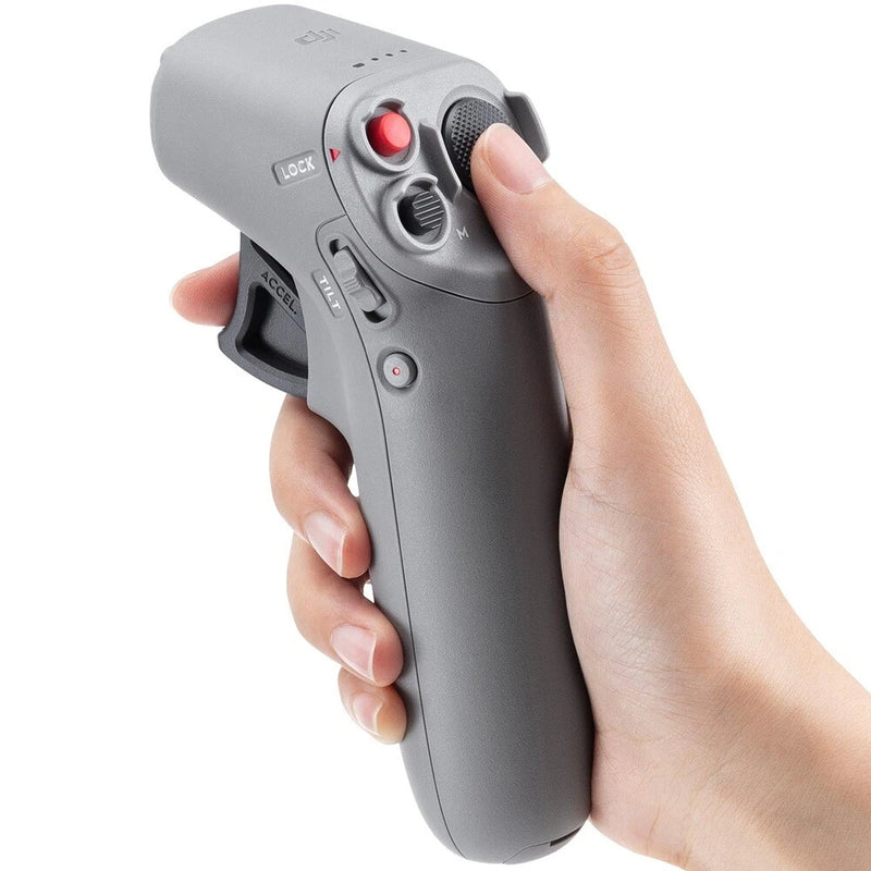 DJI motion controller handheld with red trigger and gray grip buttons