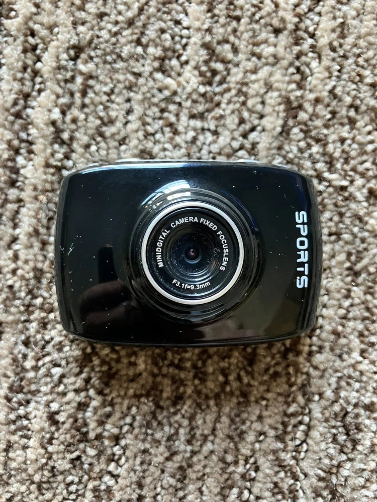 Black mini sports action camera with front lens and side display